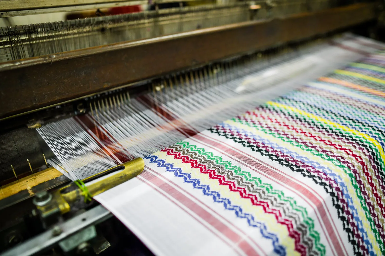 Close-up of red Palestinian kufiya weaving in cotton thread
